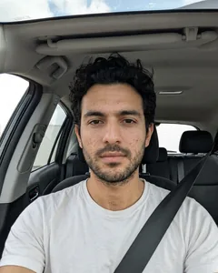 Input selfie: taken in a parked car in daylight